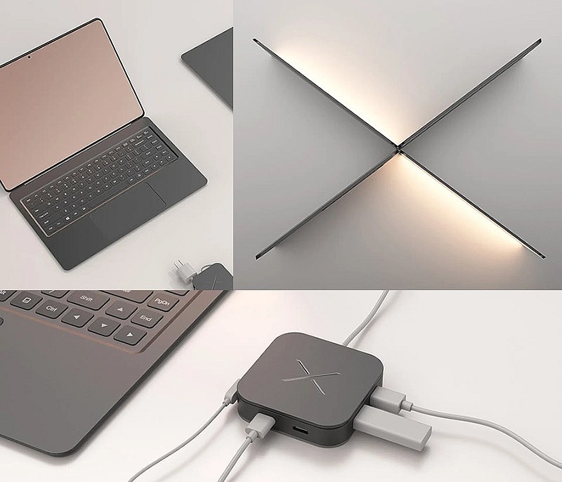 Ноутбук имеет беспроводное зарядное устройство с разнообразными разъемами, которое крепится к задней панели ноутбука с помощью магнита